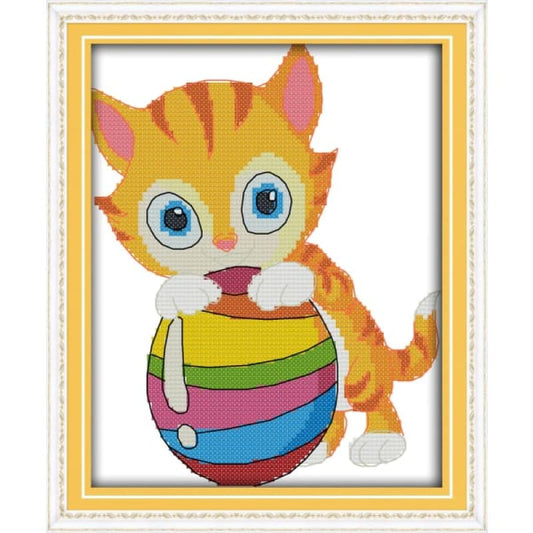 The cat playing with a ball